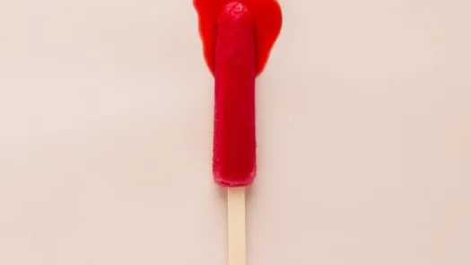 A melting red ice lolly that looks a little like a used tampon